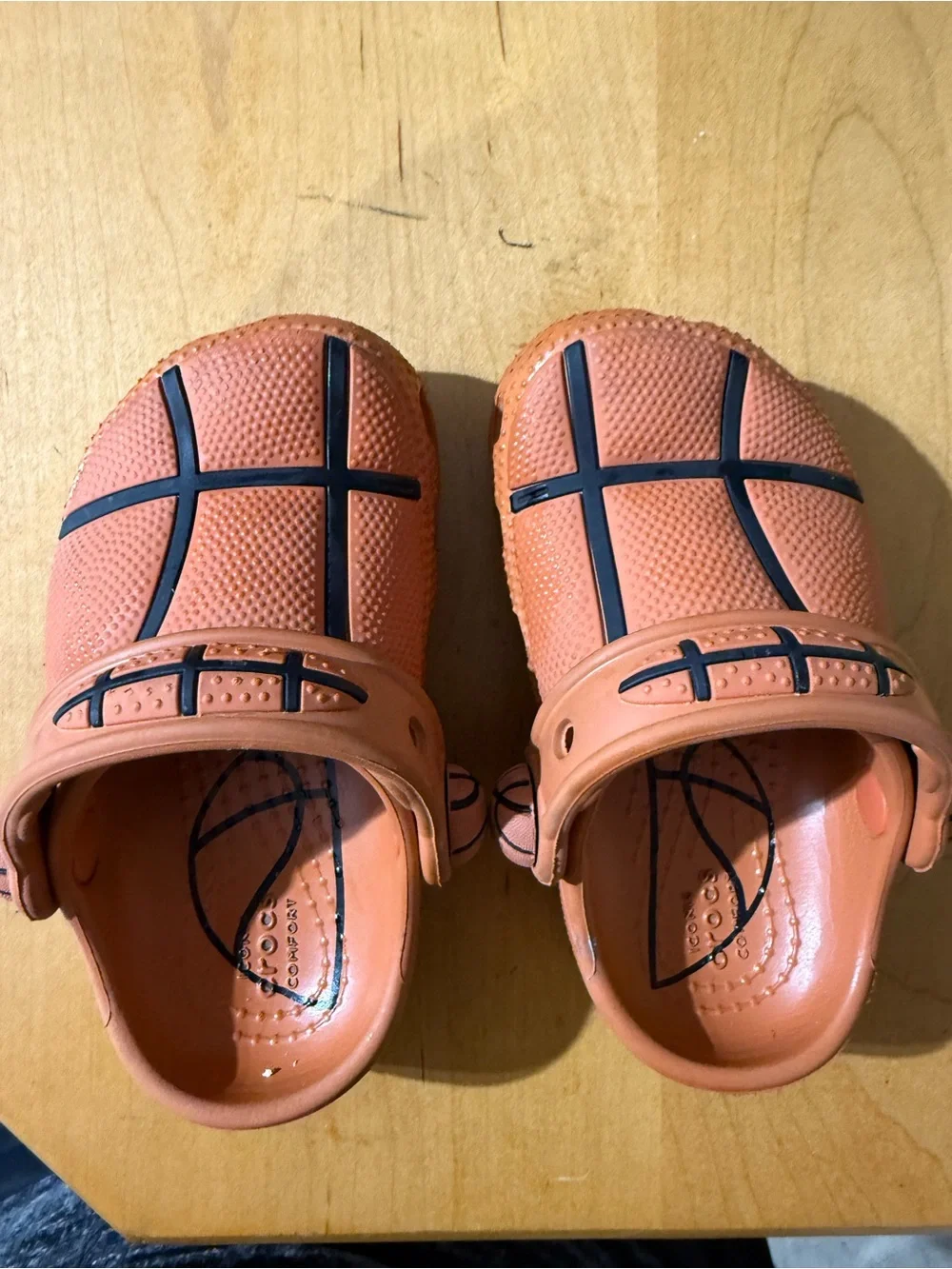 CROCS Kids Orange Clogs with Black Basketball Accent